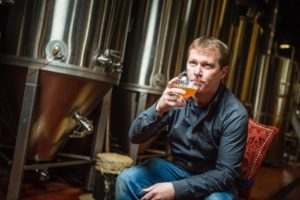 Michael Carroll, Head Brewer, with his Michelin-starred brewpub's PKW Fermenters